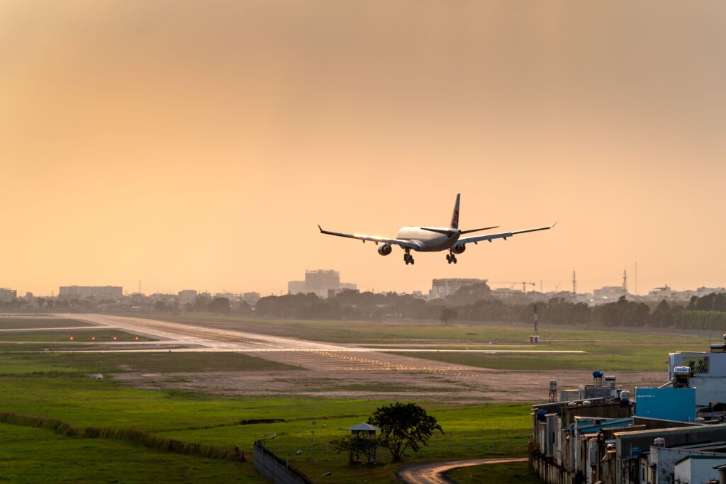 Flugzeug landet als symbol für die Ankunft nach der Auswanderung